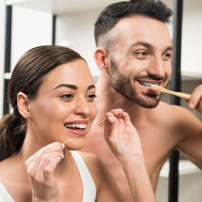 Couple Brushing Their Teeth